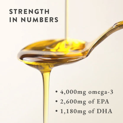 A spoonful of Bare Biology Pure Omega-3 Liquid Fish Oil with oil being poured. Text: Strength in numbers. 4,000mg high-strength omega-3, 2,600mg EPA, 1,180mg DHA.